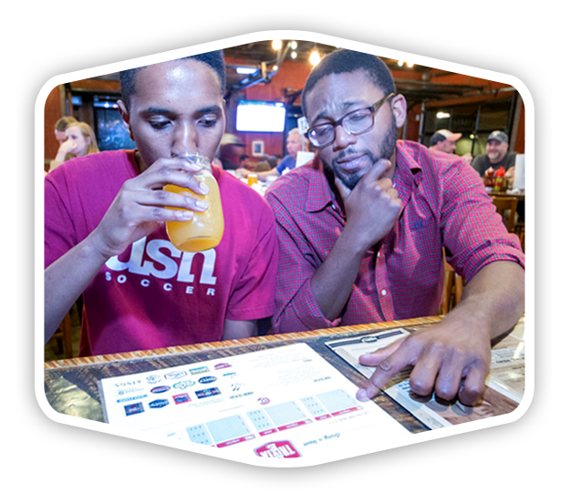 playing-live-bar-trivia Two men playing live bar trivia