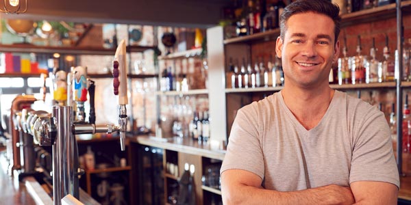 venue-owner-callout Bar owner next to beer taps