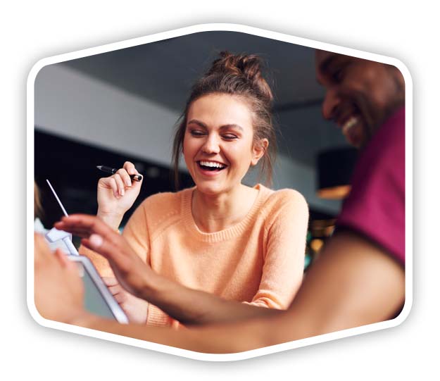 woman-trivia-whiteback A woman with a pen in her hand playing a bar game with a friend